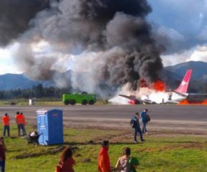 Passenger plane bursts into flames before skidding off runway during emergency landing in Peru