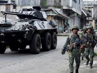 Dozens dead as Philippine troops, supported by gunships, fight militants in southern city of Marawi