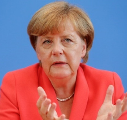 Merkel says walls won’t end immigration issues