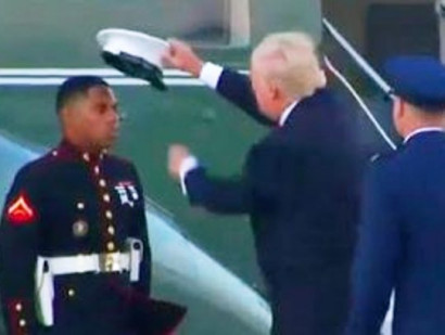 Trump Puts Marine's Hat Back On After Wind Blows It Away