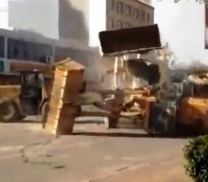 Watch Six Bulldozers Battle Each Other on the Streets of China in the Craziest Fight Ever