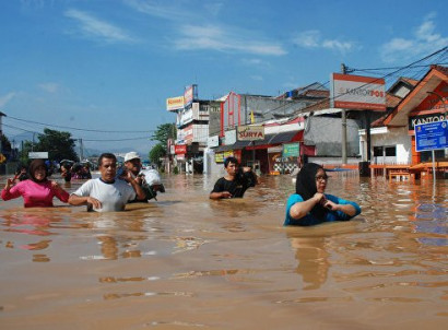 At least 20 dead as floods and landslide hit Indonesia