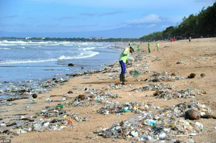 Bali's tourist beaches are disappearing under a mountain of plastic garbage with 100 tons of rubbish being removed each day