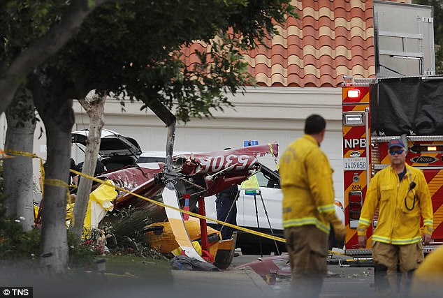 At least three dead and multiple people injured after helicopter crashes into a house
