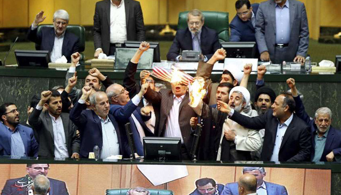 Iranian lawmakers set paper US flag ablaze at parliament