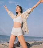 When I was Jolie young: 'Lost' fashion pictures taken for tiny British style magazine show Angelina reaching for the sky at the age of 18