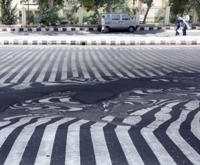 India's killer heatwave is now so hot it causes the roads to MELT: Death toll soars above 1,100 and people are told to stay indoors as crisis continues