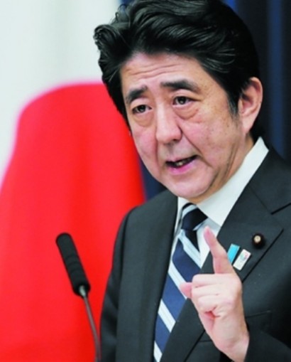 Japan's Abe keeps allies in key posts as attention returns to economy