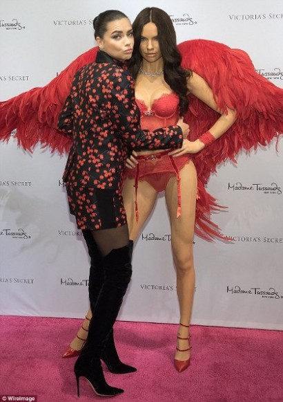 Two racy! Victoria's Secret Angel Adriana Lima looks thrilled as she gropes her own lingerie-clad wax figure during Madame Tussauds unveiling