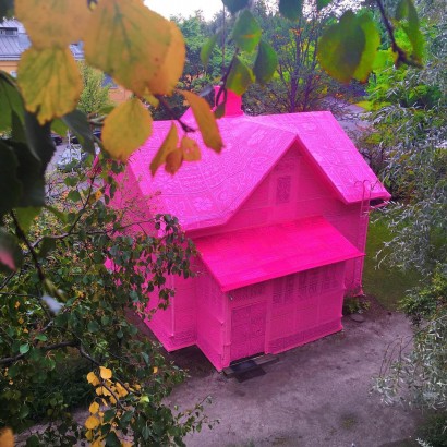 Artist Olek Covers a House in Finland with Pink Crochet