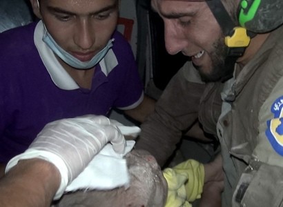 Syria: Rescue worker cries with joy after digging for four hours to rescue baby girl caught in air strike