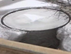 Spinning ice disk in Michigan's Pine River