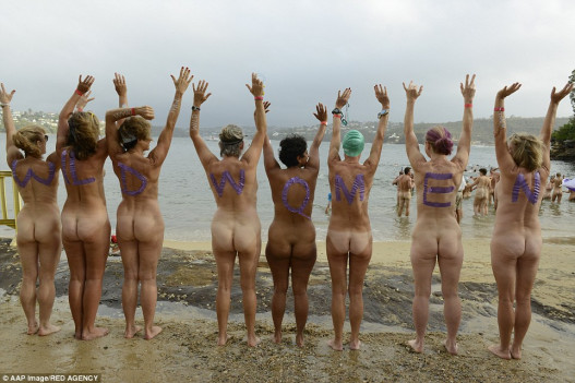 Beach bums! More than a thousand skinny dippers bare it all in the annual nude swim in Sydney