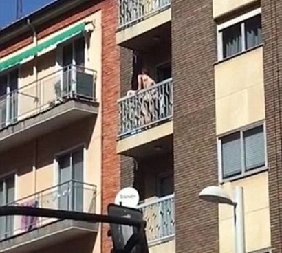 Bonkers! Naked couple spotted having sex on a fourth-floor balcony are shamed on Spanish TV after footage goes viral