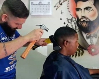 This barber uses an AXE for his clients’ haircuts