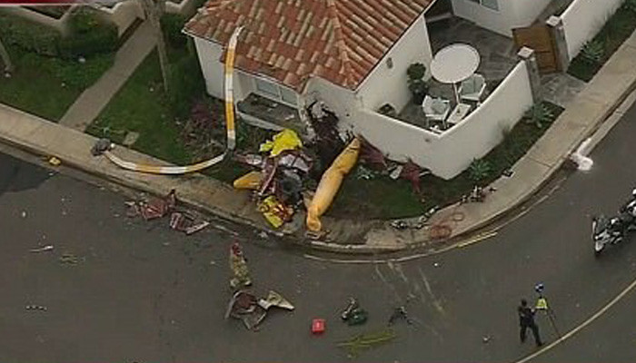 At least three dead and multiple people injured after helicopter crashes into a house