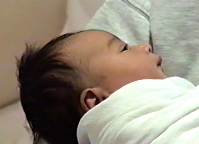 Kim Kardashian and Kanye West's newborn daughter Chicago is seen for the FIRST TIME in Kylie Jenner's birth announcement video