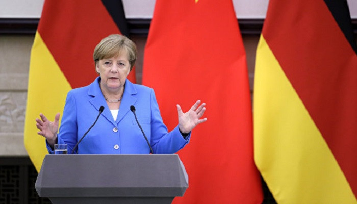 Merkel in China, says Berlin, Beijing support Iran nuclear deal