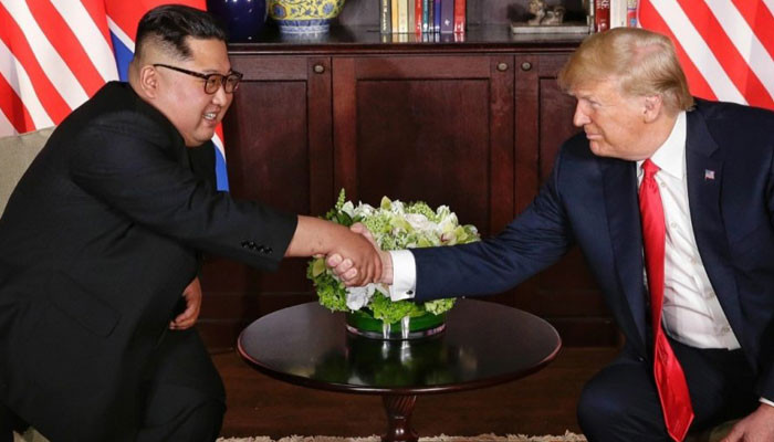 Here's the moment President Donald Trump met Kim Jong Un for the first time