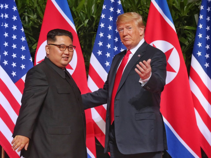 Here's the moment President Donald Trump met Kim Jong Un for the first time