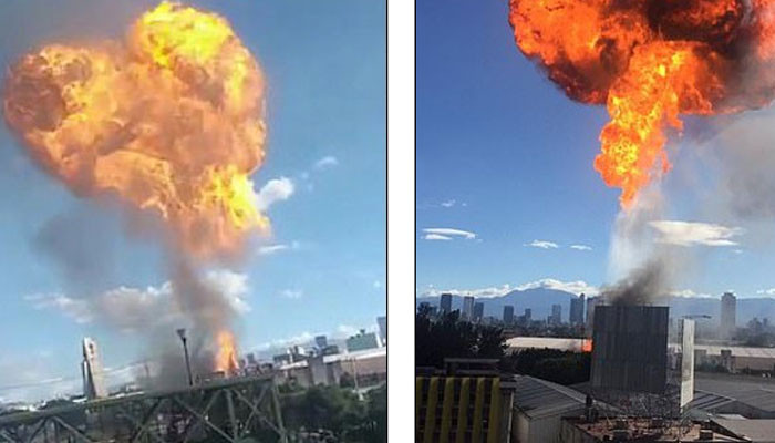 Huge fireball dominates the skyline in Mexico City as an alcohol factory explosion leaves one injured and 2,000 evacuated from their homes 
