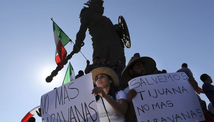 'Out! Out!': protests grow in Tijuana against migrant caravan