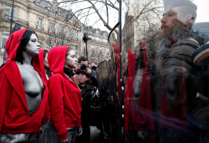 Bare-breasted, silver-painted ‘Mariannes’ confront police in Paris