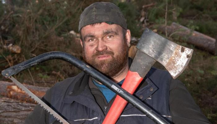 LUMBERJACKPOT Lotto lout Michael Carroll cuts logs and delivers coal for £10 an hour after blowing £10m jackpot