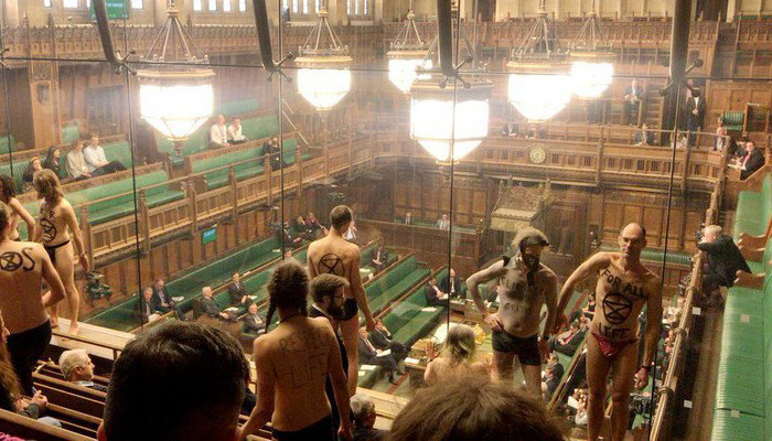 Semi-naked climate protesters disrupt Brexit debate