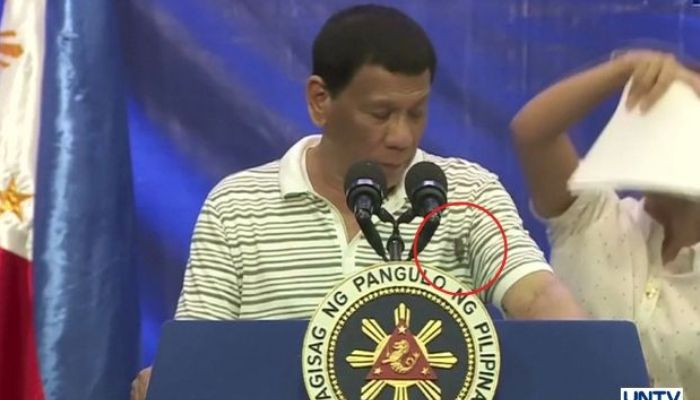 Cockroach crawls up Philippines' Duterte during live speech