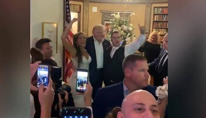Trump made a surprise appearance at a wedding reception at his New Jersey golf club. The crowd chanted, 'USA! USA!'