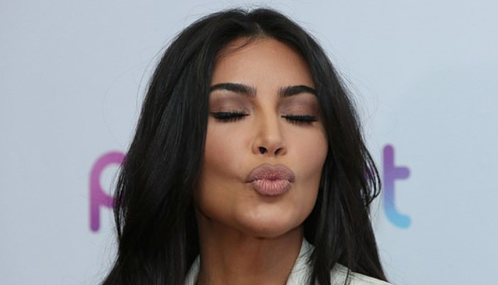 Kim Kardashian blows kisses to fans at a technology convention in Armenia