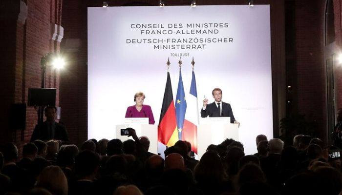 Merkel and Macron Publicly Clash Over NATO