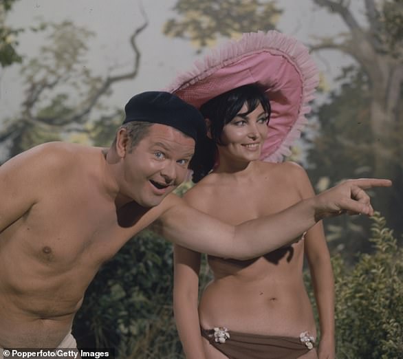 Life and times: Benny Hill was born Alfred Hill on January 21, 1925 in Southampton, England and is remembered by family and schoolmates as a 'class clown'. Pictured on The Benny Hill Show in 1968 with Belgian actress Bettina Le Beau