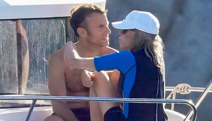 Emmanuel Macron and wife Brigitte look the picture of love during holiday in France