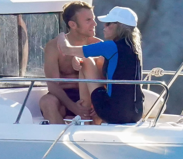 Emmanuel Macron and wife Brigitte look the picture of love during holiday in France